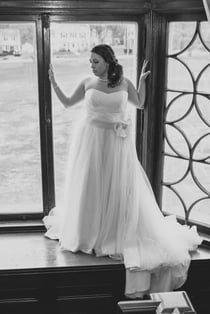 Bridal shot of bride on big window sill.jpg