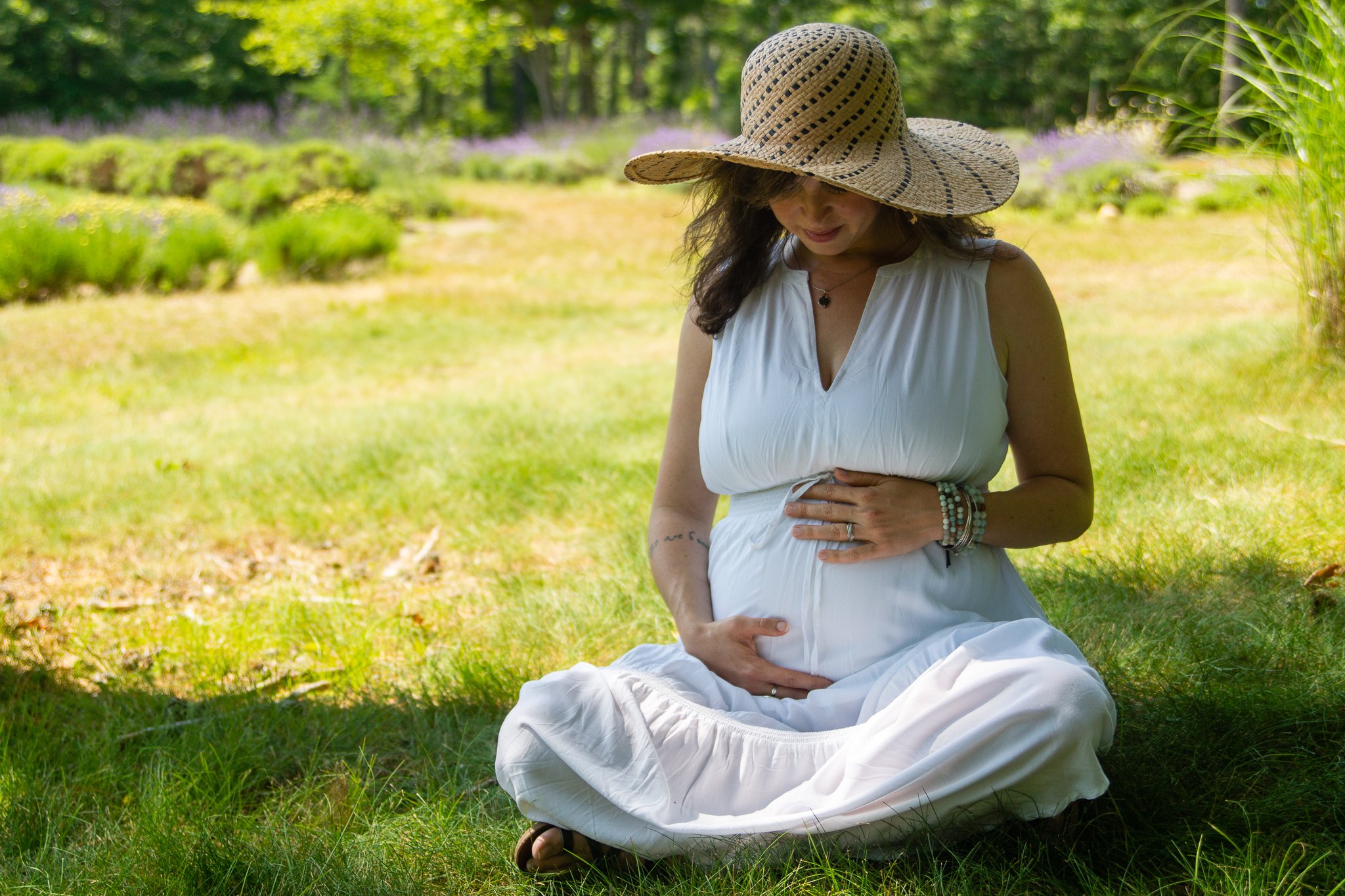 Maternity - Pregnant Mom sitting in field